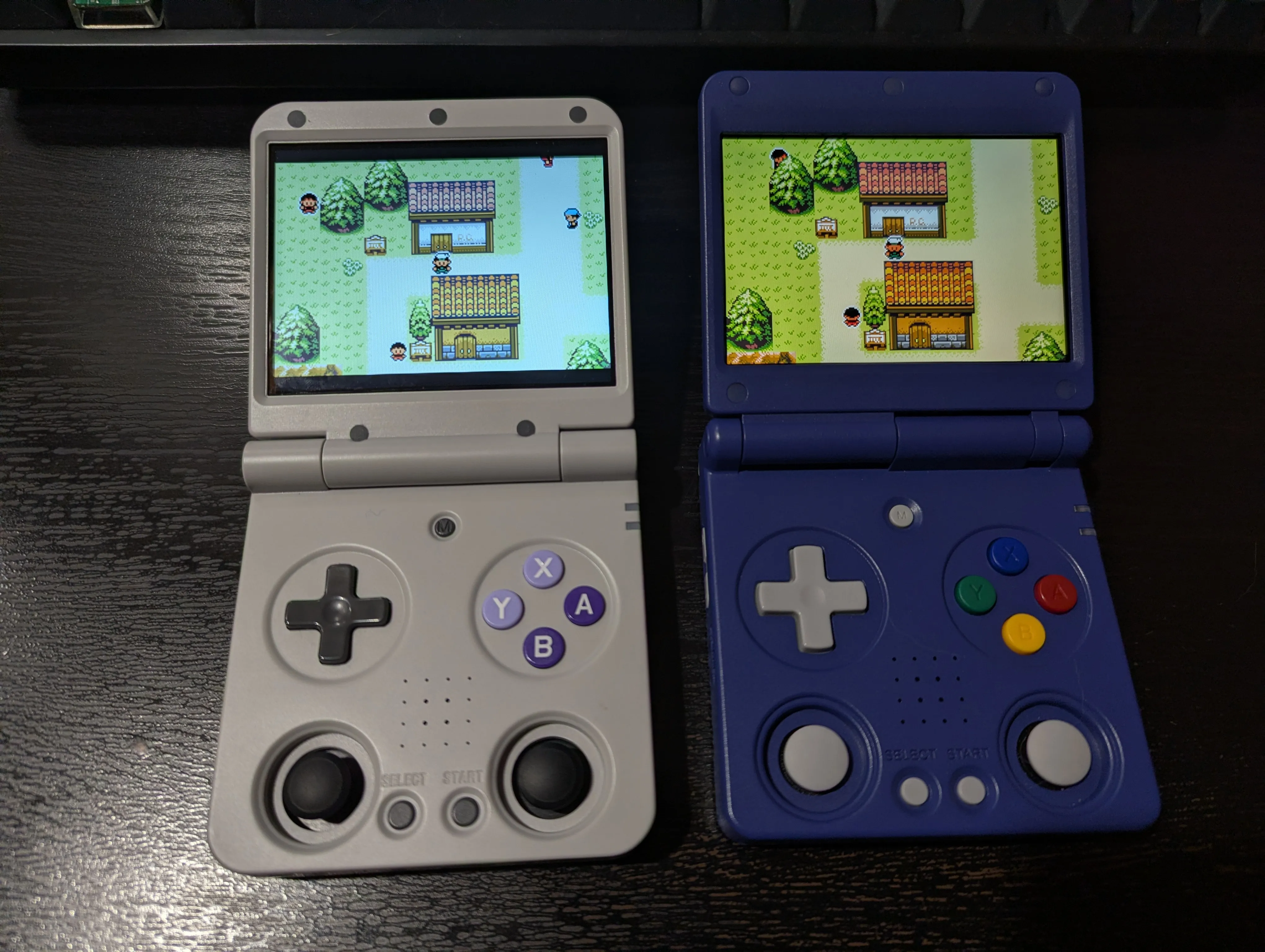 "The Miyoo Flip (right) vs. the Anbernic RG34XXSP (left), with Pokémon Emerald Seaglass running."