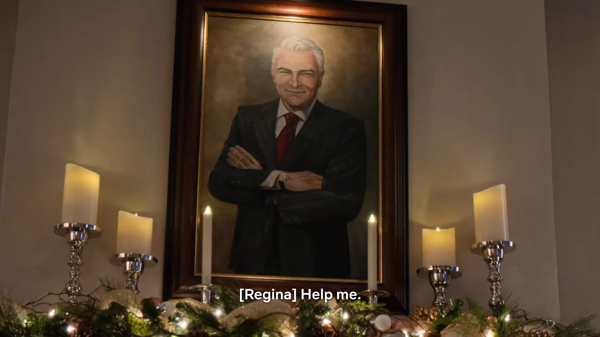 A screenshot from Christmas on the Square in which Jack Fuller's portrait looms menacingly.